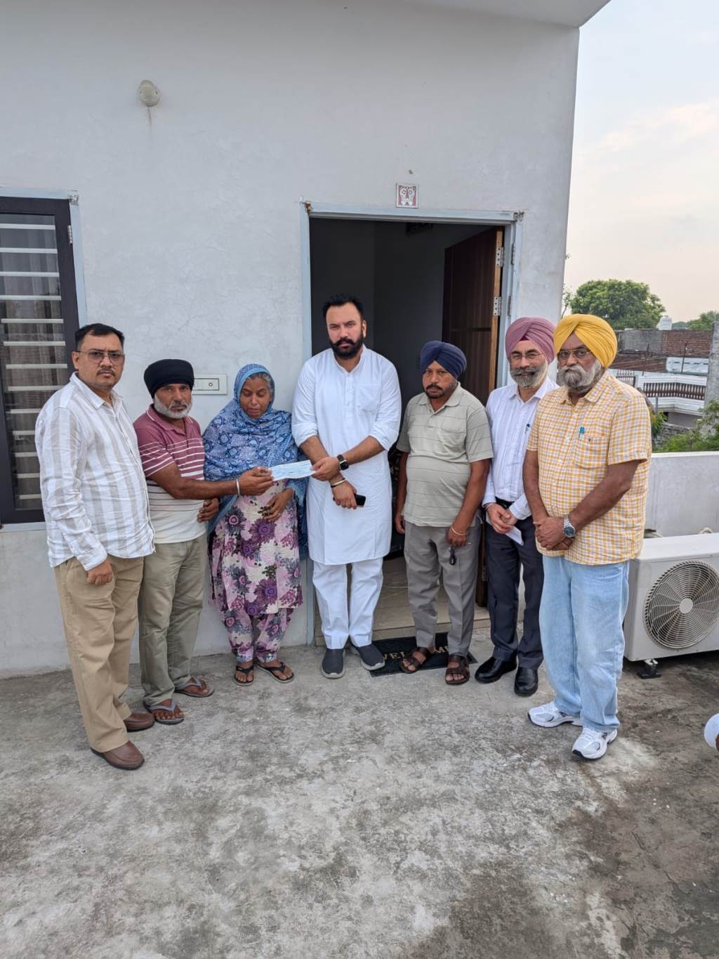 MLA Jagtar Singh Dayalpura hands over cheque of insurance amount of Rs 5 lakh to family of journalist Davinder Singh who lost life in road accident at Mohali